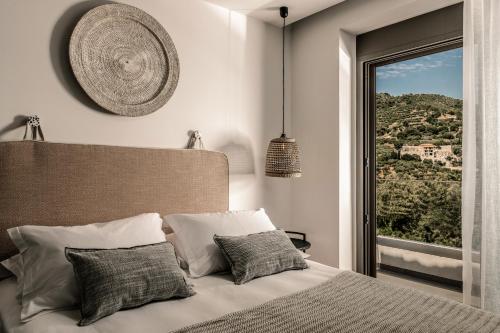 Posteľ alebo postele v izbe v ubytovaní Cossoro Villas Zakynthos
