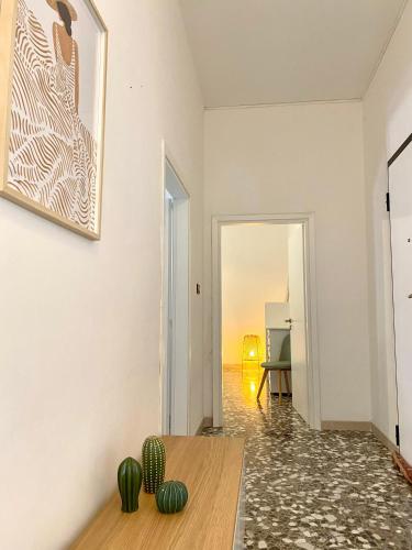 a living room with a table and a view of the ocean at La Vue est Belle - Puglia Mia Apartments in Monopoli