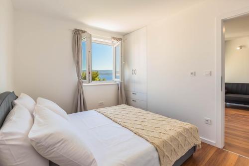 Ένα ή περισσότερα κρεβάτια σε δωμάτιο στο Sea view apartment Celina