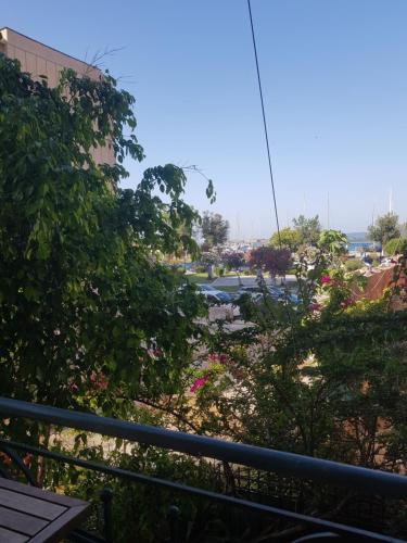 a view of a park from a balcony at Prokimea Seaview Apartments in Lefkada