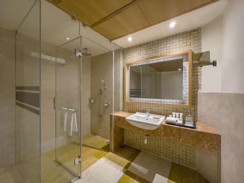 a bathroom with a sink and a shower at Radisson Salem in Salem