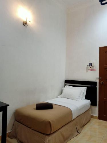 Cama o camas de una habitación en ANGGERIK IMPIAN HOTEL -Best for Travellers at Kuala Berang