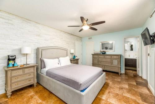 a bedroom with a bed and a ceiling fan at Steps to Sand and Sea 4 in Fort Lauderdale