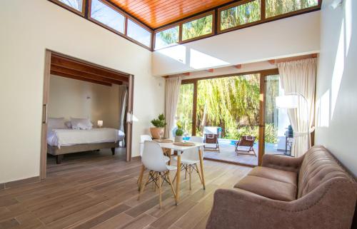 a living room with a couch and a table at Aldea del Valle - Elqui Villas, Pisco Elqui in Pisco Elqui