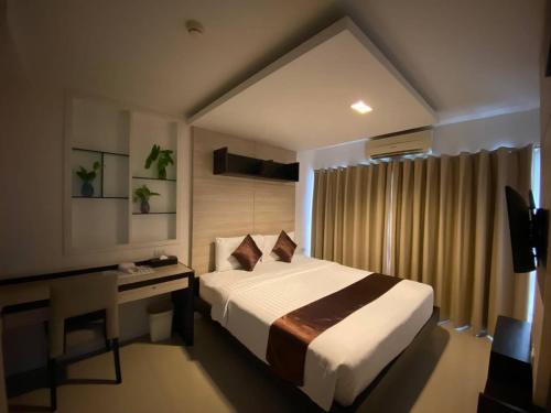 Ein Bett oder Betten in einem Zimmer der Unterkunft Bella B All Suite Bangkok