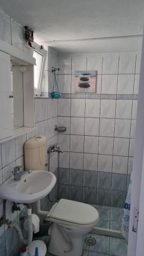 a bathroom with a toilet and a sink at Seaside appartment to enjoy,relax with great view in Gázion