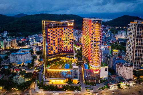 a lit up building in a city at night at Muong Thanh Luxury Ha Long Centre II in Ha Long