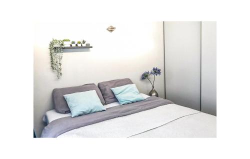 Кровать или кровати в номере Bungalowpark Wijdland-botter