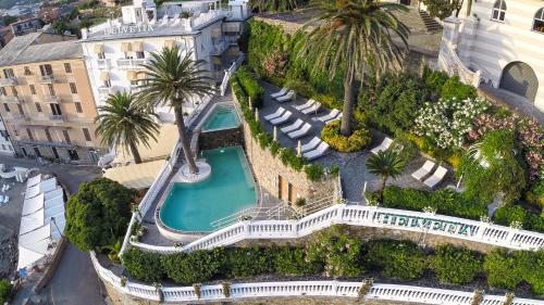 an aerial view of a mansion with a swimming pool at Hotel Helvetia in Sestri Levante
