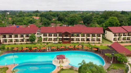 an aerial view of a resort with a large swimming pool at 36Manor International Sport Hotel in Vientiane