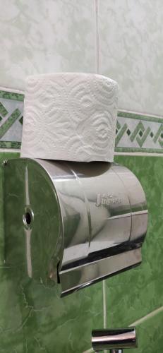 a white towel sitting on top of a toaster at Apartment in the Karakol heart in Karakol