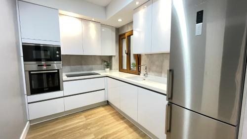 Kuchyň nebo kuchyňský kout v ubytování Luxury apartment in central town