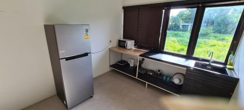 Kuchyň nebo kuchyňský kout v ubytování Samutra Residences