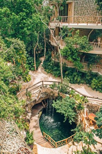 an overhead view of a garden with a bridge at Kan Tulum Hotel in Tulum