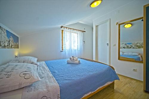 Ένα ή περισσότερα κρεβάτια σε δωμάτιο στο Guest House Matana Pomena