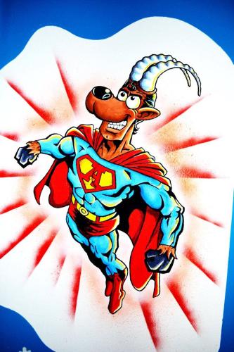 a cartoon of a man in a superhero costume at Alpking Hostel in Ellmau