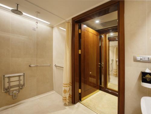 a bathroom with a shower and a glass door at Ottoman's Life Hotel Deluxe in Istanbul