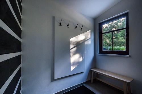 a corner of a room with a window and a bench at Chalupa Křenov 62 in Bernartice
