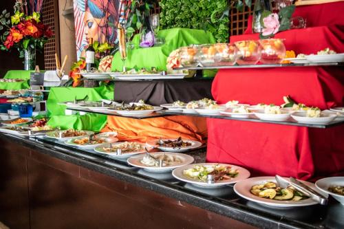 a buffet line with many plates of food at Radisson Colon 2,000 Hotel & Casino in Colón