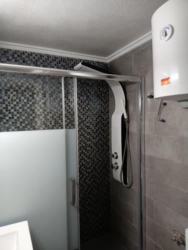 a shower with a glass door in a bathroom at ESTUDIO EMMA in Torrevieja