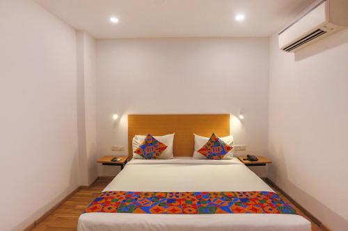 a bedroom with a bed in a room at FabHotel A One Paschim Vihar in New Delhi