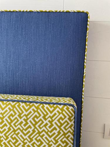 a blue chair with a yellow and white pattern at Casa a Mare in Sorrento