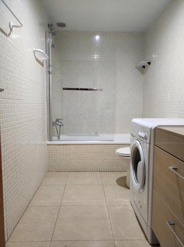 a bathroom with a washing machine in a bathroom at Boadella-Fenals in Lloret de Mar