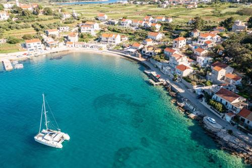 an aerial view of a boat in a body of water at Apartments Nikolina in Lumbarda