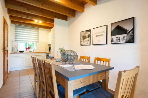 a kitchen and dining room with a table and chairs at Ferienhof Homann Sauerland in Brilon