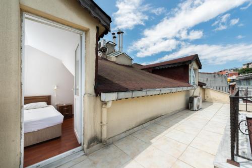 a bedroom with a bed on a balcony at Dualis Hotel in Istanbul