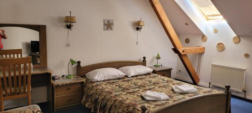 Postel nebo postele na pokoji v ubytování Hotel Tukums