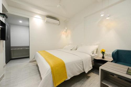 Postel nebo postele na pokoji v ubytování Hotel Vijay Fablis