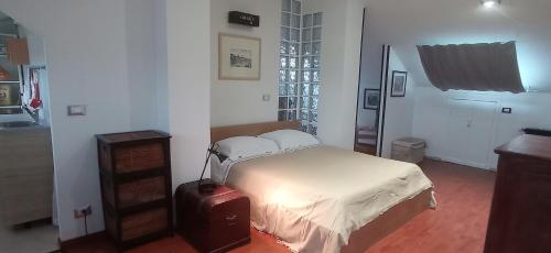 Postelja oz. postelje v sobi nastanitve Appartamento mansardato iPatrizi