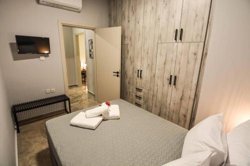 Ένα ή περισσότερα κρεβάτια σε δωμάτιο στο GM Apartment