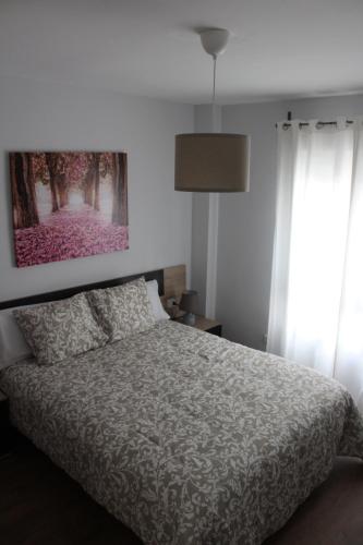 Postel nebo postele na pokoji v ubytování INCREIBLE APARTAMENTO CENTRO GRANADA ALHAMBRA