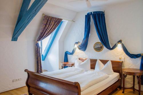 En eller flere senge i et værelse på Hotel Vier Jahreszeiten