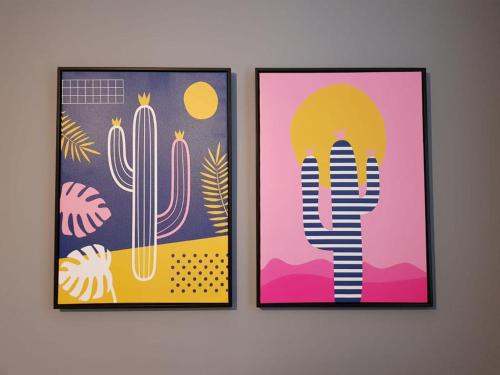 two framed posters of cactuses and cactus at The Westside with Parking in York