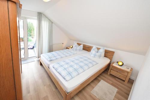 Postel nebo postele na pokoji v ubytování Albrecht-Jäger Fewo