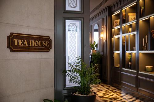 a tea house with a plant in front of a door at Hyatt Regency Belgrade in Belgrade