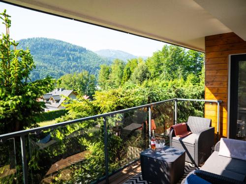 a balcony with a view of the mountains at Apartament Lux View Szczyrk Sauna Jacuzii in Szczyrk