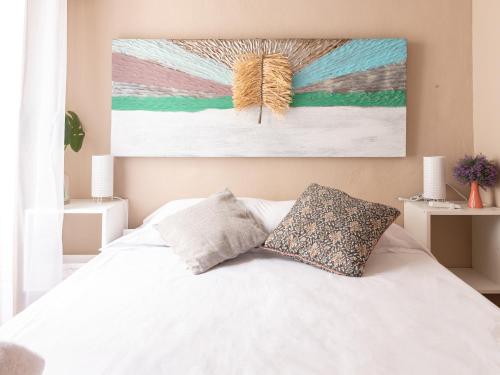 A bed or beds in a room at Apartamento Nayber Especieros
