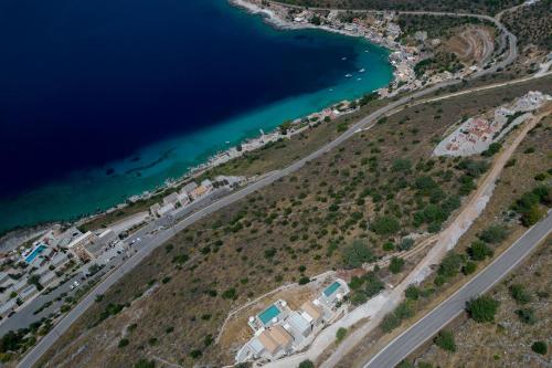 an aerial view of a beach and the ocean at ERMIS-APEA Villas in Limeni