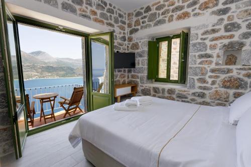 Postel nebo postele na pokoji v ubytování POSEIDON-APEA Villas