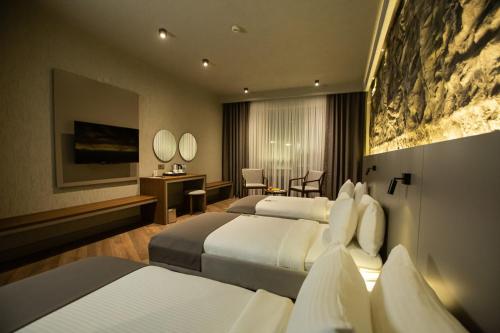 Postel nebo postele na pokoji v ubytování The Erzurum Hotel