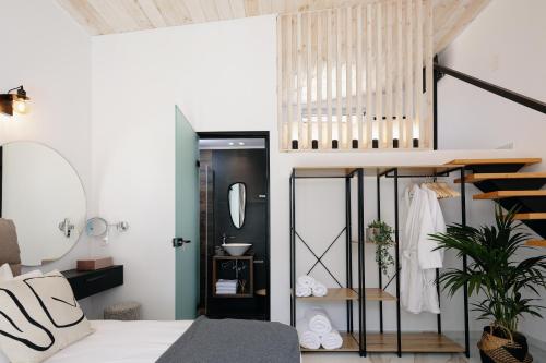 a bedroom with a bed and a mirror at Solis Villa, with Heated Pool & 5 minutes to Beach, By ThinkVilla in Kavros