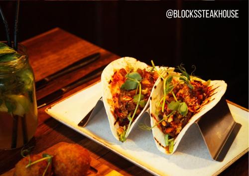 two tacos on a plate on a table at Allerdale Court Hotel in Cockermouth