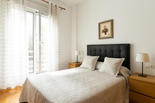 Postel nebo postele na pokoji v ubytování Apartamento riosella centro