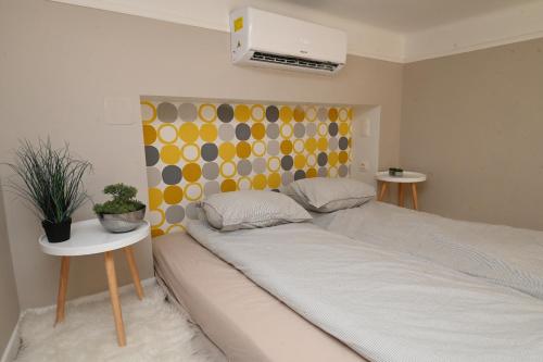 Letto o letti in una camera di Palms Apartments Budapest
