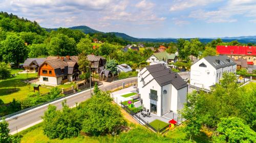 an aerial view of a small town with a house at Domki Sikorskiego II, Sun & Snow in Karpacz