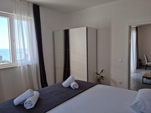 Ένα ή περισσότερα κρεβάτια σε δωμάτιο στο Apartment Noel Cavtat 1